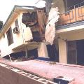 Collapsed second story of apartment complex onto soft-story after Northridge earthquake.